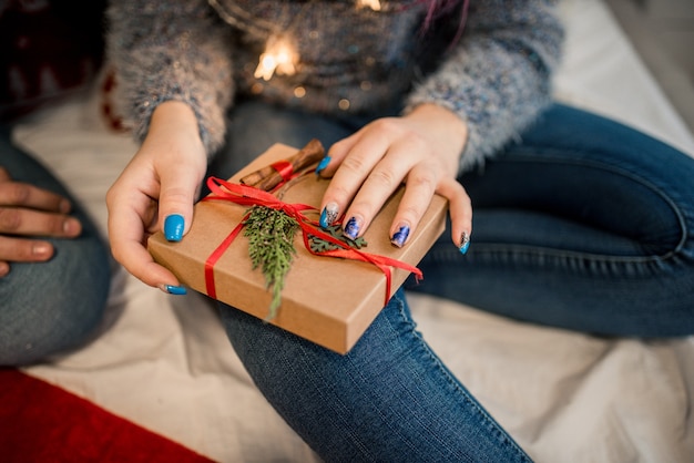 Couple Wrapping Christmas Gifts At Home. Christmas craft box.