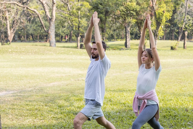 Couples are exercising in the park.