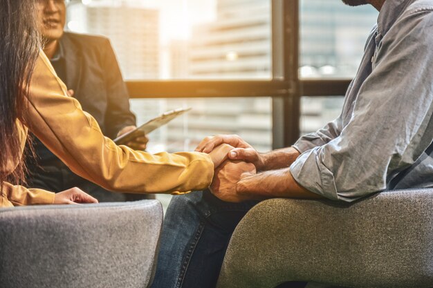 Couples discussing family problems with a psychiatrist.