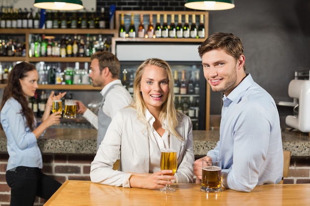 Couples holding beer 