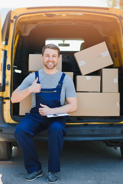 The courier brought the delivery of the box to the client Courier service employee in uniform