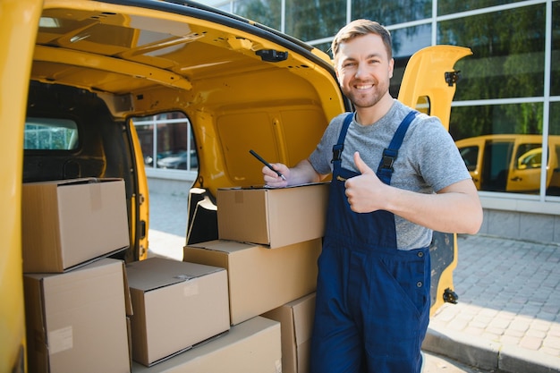 The courier brought the delivery of the box to the client Courier service employee in uniform