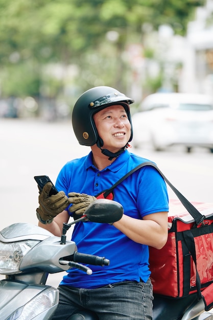 Courier checking address of client