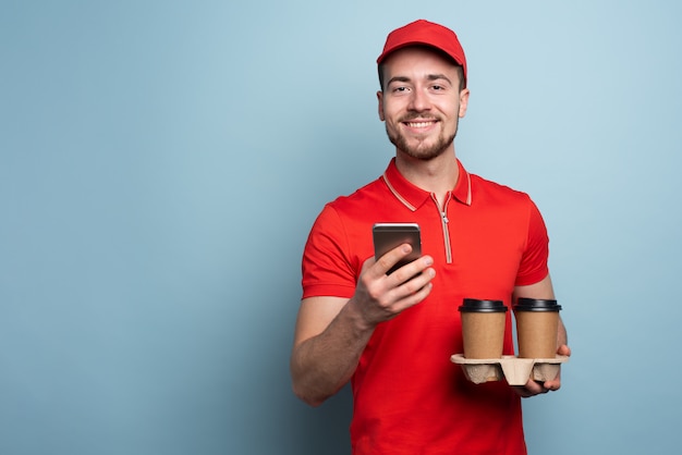 Courier delivering cups of coffee