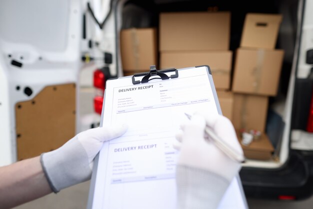 Courier holds receipt for delivery of goods