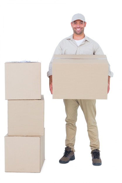 Photo courier man carrying cardboard box