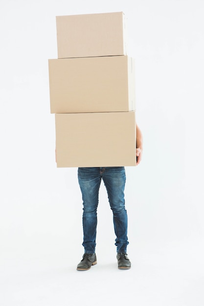 Courier man carrying cardboard boxes