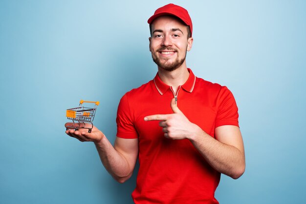 Courier man shows the cart where to buy