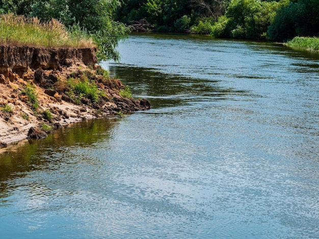 Photo the course of the river along the steep bank