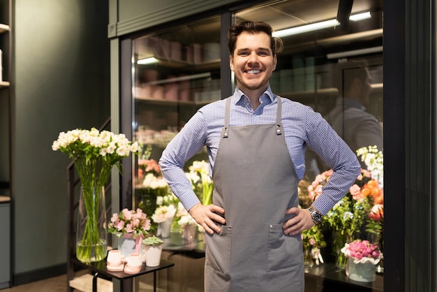 Courteous seller of the salon of flowers and bouquets