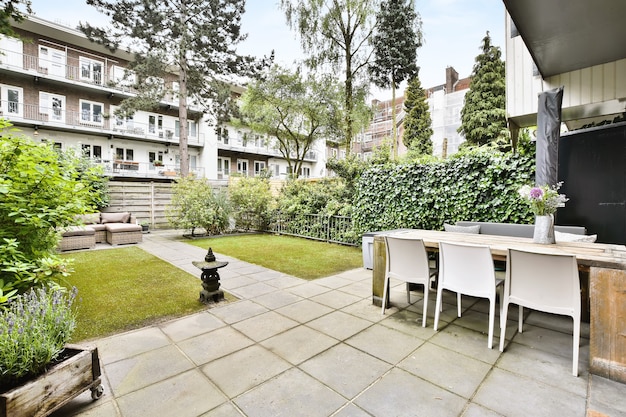 The courtyard of an elegant house with a lawn