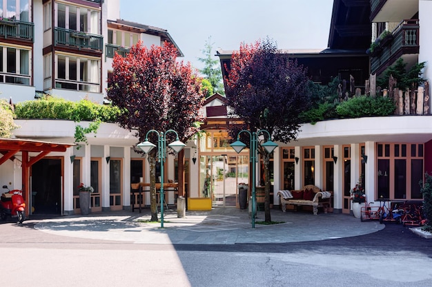 Courtyard of Hotel family resort with outdoor in summer. Modern design. Exterior Front view of Complex of buildings. Blue sky. Relax and holiday.