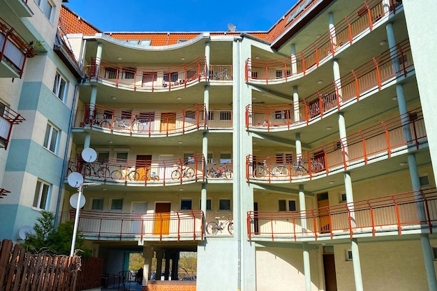 Courtyard with balconies in a multistorey residential building bike storage on the balcony