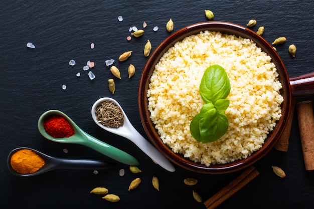 Couscous in brown ceramic bowl