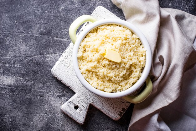 Couscous with butter in pot