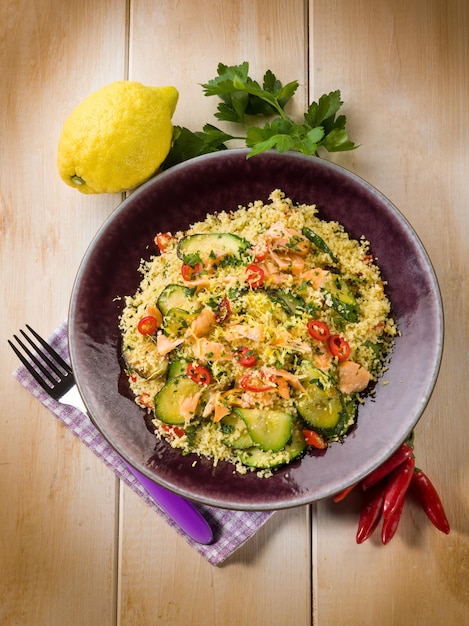 Couscous with fresh salmon zucchinis and hot chili pepper