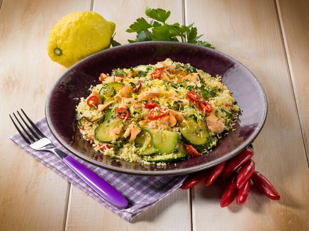 Couscous with fresh salmon zucchinis and hot chili pepper