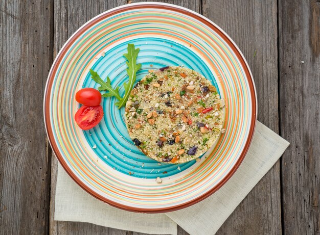 Couscous with shrimps and vegetables in a bowl