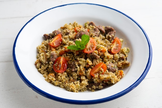 Couscous with vegetables and beef marinated with fresh mint