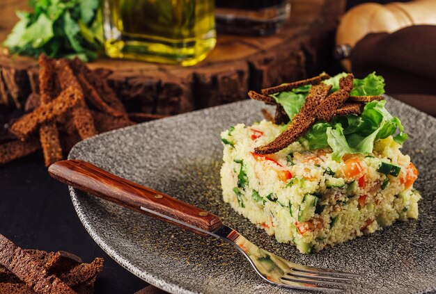 Couscous with vegetables served in plate