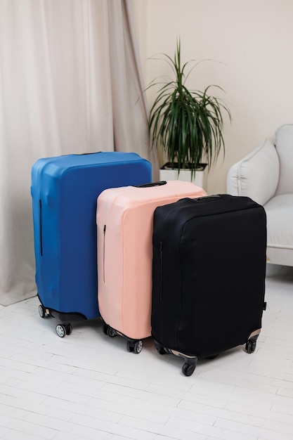 Cover for a suitcase with wheels Suitcase for things in a cover against damage A suitcase for a tourist