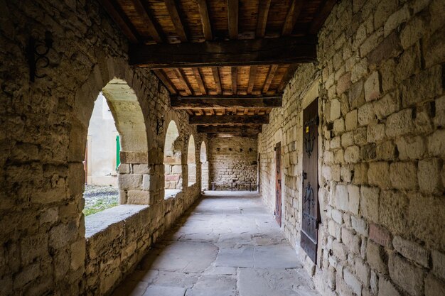 The covered archways of the medieval cloister of Saint Agnes priory in Saint Jean de Galaure (Drome)