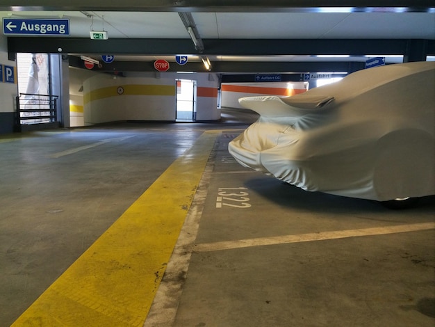 Covered car in parking lot