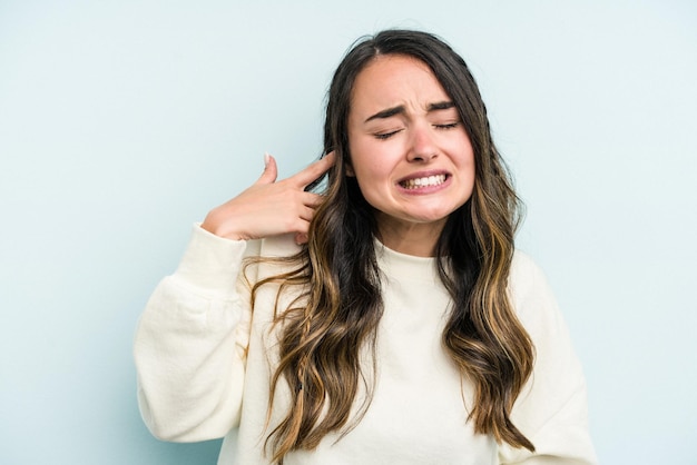 Covering ears with hands