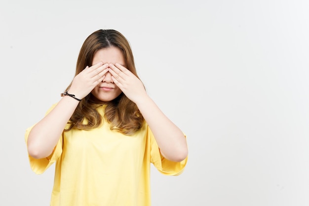 Covering eyes of Beautiful Asian Woman wearing yellow TShirt Isolated On White Background