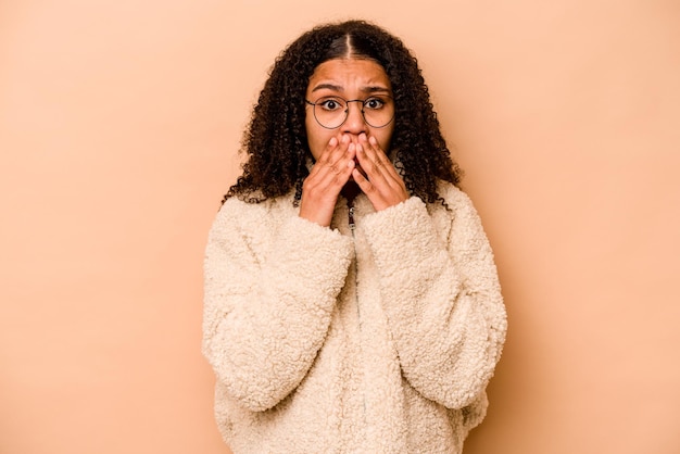 Covering mouth with hands looking worried