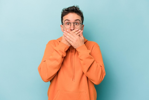 covering mouth with hands looking worried
