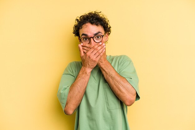 covering mouth with hands looking worried