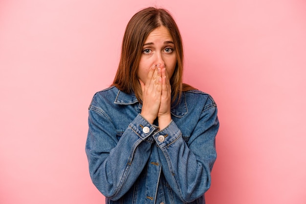 Photo covering mouth with hands looking worried