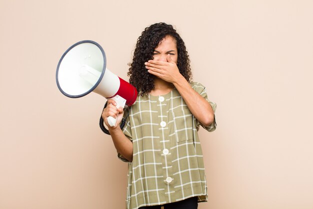 covering mouth with hands with a shocked, surprised expression, keeping a secret or saying oops