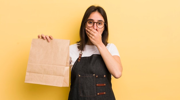 Covering mouth with hands with a shocked