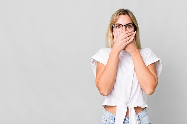 Covering mouth with hands with a shocked