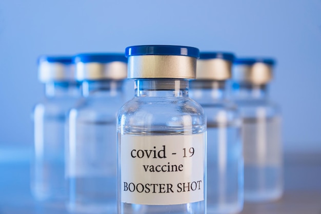 COVID-19 booster vaccine vials. Medicine and health care concept