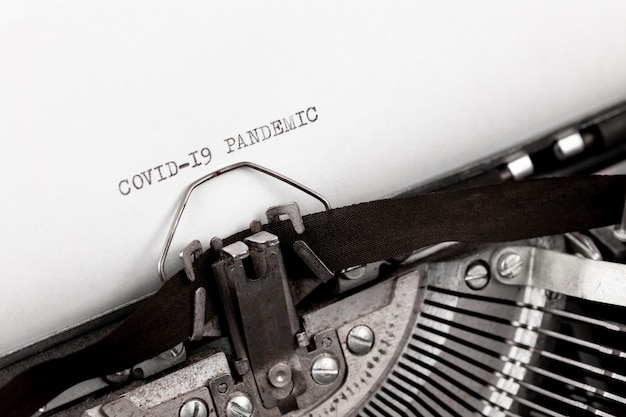 Photo covid-19 pandemic printed on a vintage typewriter