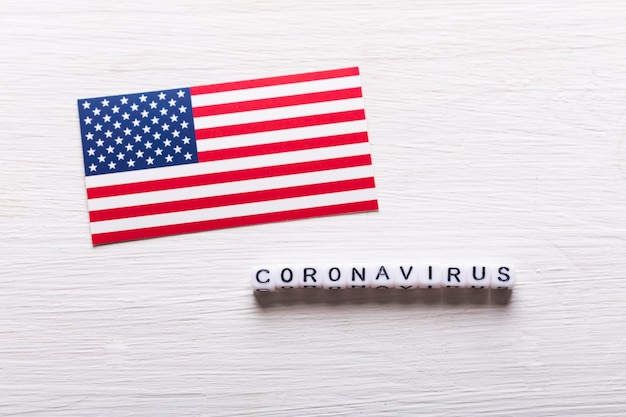 Covid-19, pandemic and virus concept - coronavirus with american usa flag on white background.