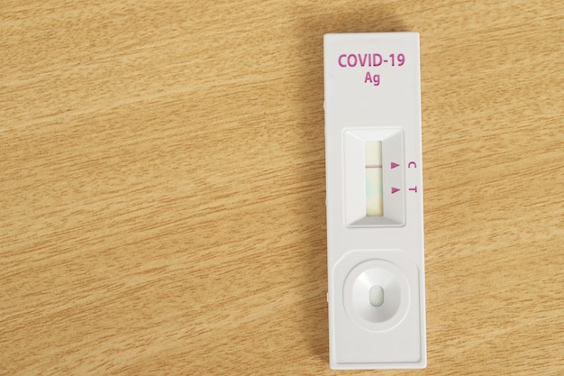 Covid-19 test kit on a wooden table