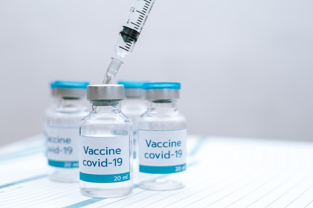 Covid-19 vaccine disease preparing vaccination shot, medicine and drug concept.