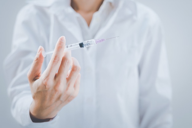 Photo covid-19 vaccine in researcher hands