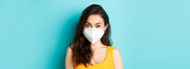 Covid coronavirus and social distancing attractive young woman wearing respirator from coronavirus l