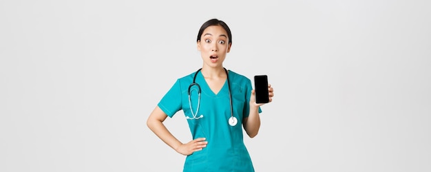 Covid healthcare workers and online medicine concept excited and amazed asian female nurse doctor lo...