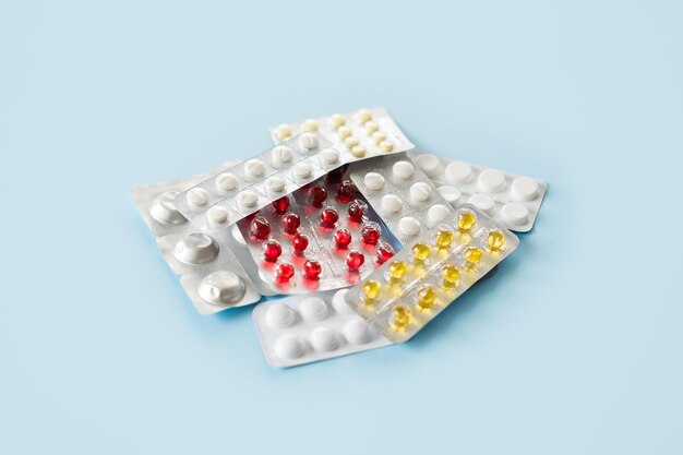 Covid pills concept many pills and capsules in blisters covid coronavirus drugs first antiviral