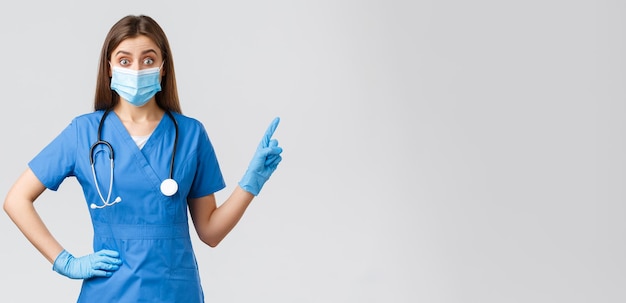 covid preventing virus health healthcare workers concept intrigued and excited female doctor nurse i