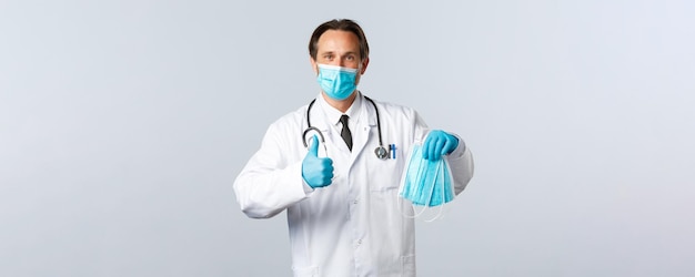 Covid preventing virus healthcare workers and vaccination concept satisfied doctor in medical mask a