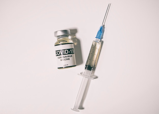 Covid19 coronavirus vaccine and syringe