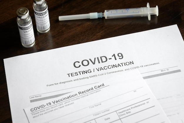 COVID19 test and vaccine form on desk in clinic