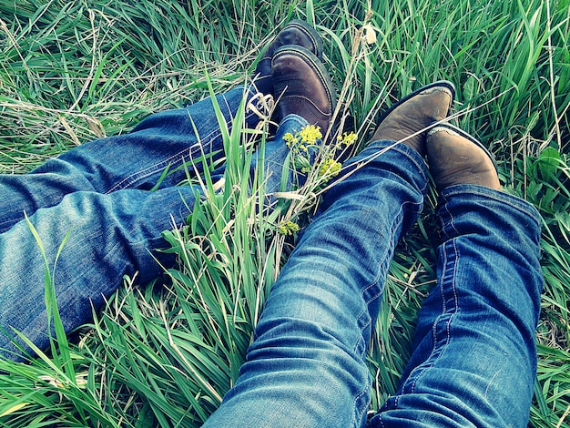 Cowgirl boots in the green grass